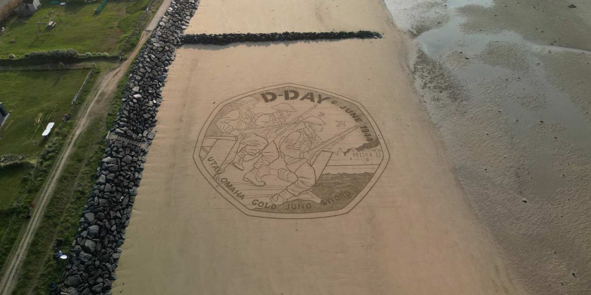 D-Day 80 coin design recreated in sand art on Gold beach