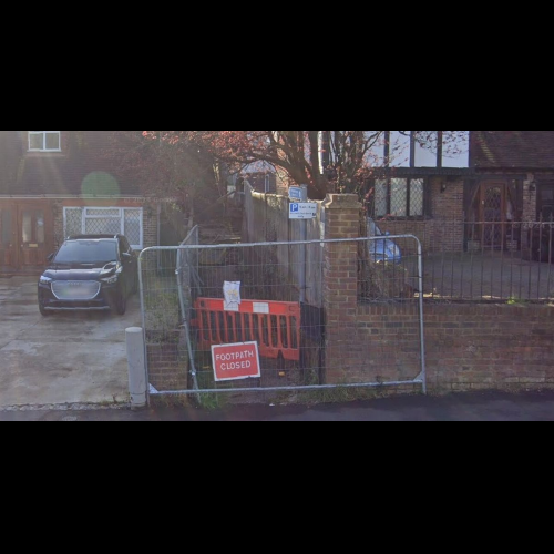 Warring neighbours call police after man blocks public footpath and refuses to let anyone near it